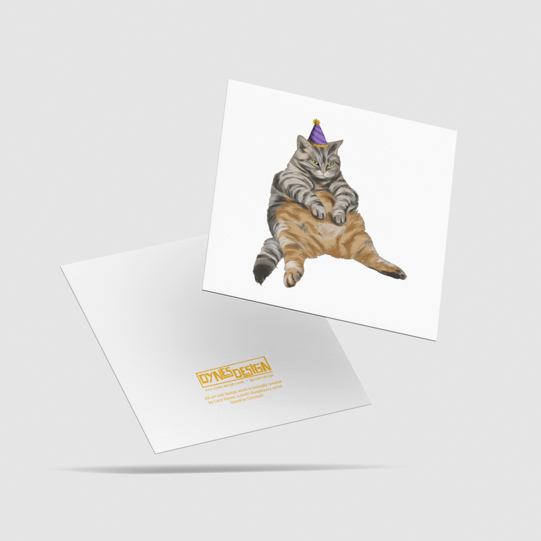 A square white greeting card and its reverse are shown on a light gray background. The front of the card features an illustration of a gray tabby cat wearing a purple party hat, the back has the brand mark and info