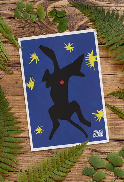 A vertical art print featuring a black silhouette of a greyhound on a deep blue background with yellow starbursts and a small red dot, styled on a rustic wooden surface with green fern leaves.