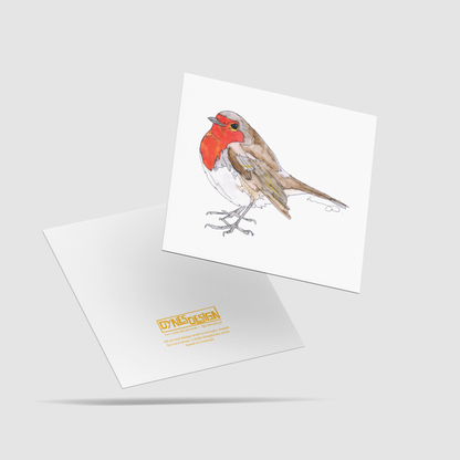 A square white art print card featuring a watercolor-style robin bird with a bright red breast, shown floating above the back image which has the logo mark "DYNES DESIGN", all on a light gray background.